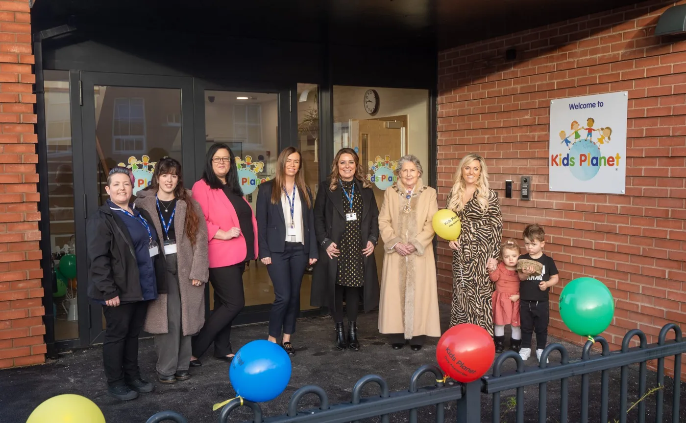 A group outside the entrance to Kids Planet Stanley Square on Springfield Road, Sale.